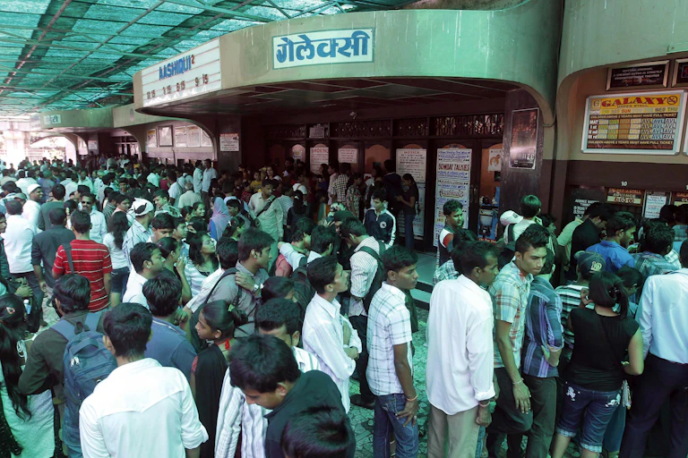A crowd of people outside a cinema