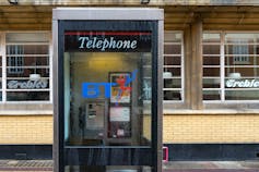 A telephone box with the old style BT 