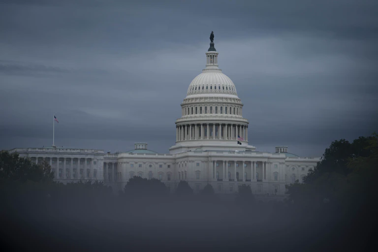 The US Capitol, obscured by fog
