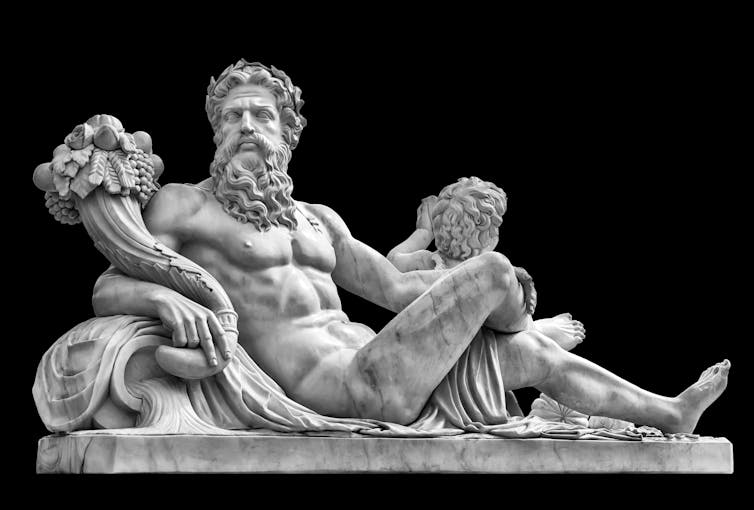 Statue du Dieu grec Zeus avec une corne d’abondance, d’où sort en profusion des fruits et des vivres