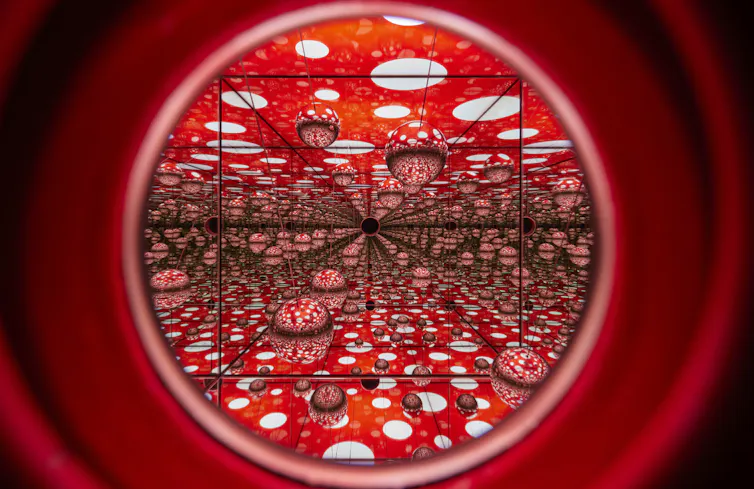 A red room with mushrooms and dots.