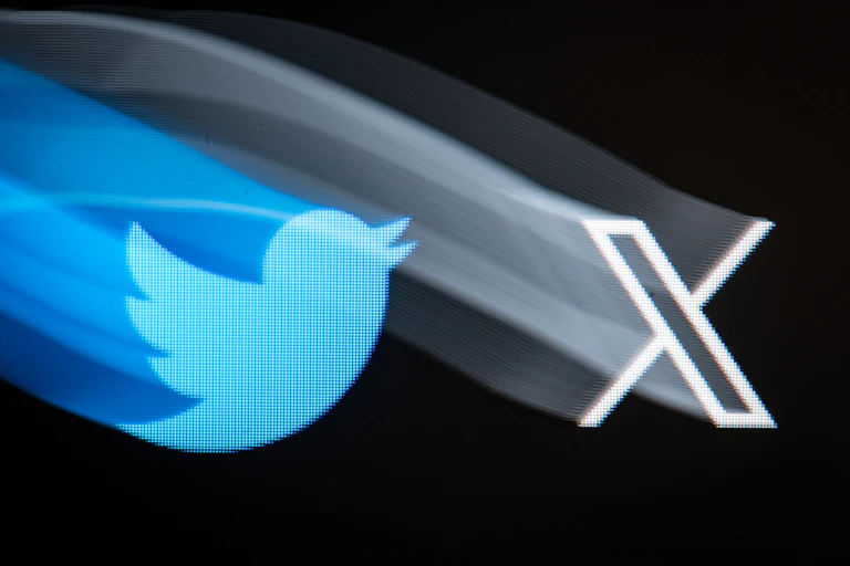 Blurry versions of the old blue Twitter bird logo and the new black X logo.