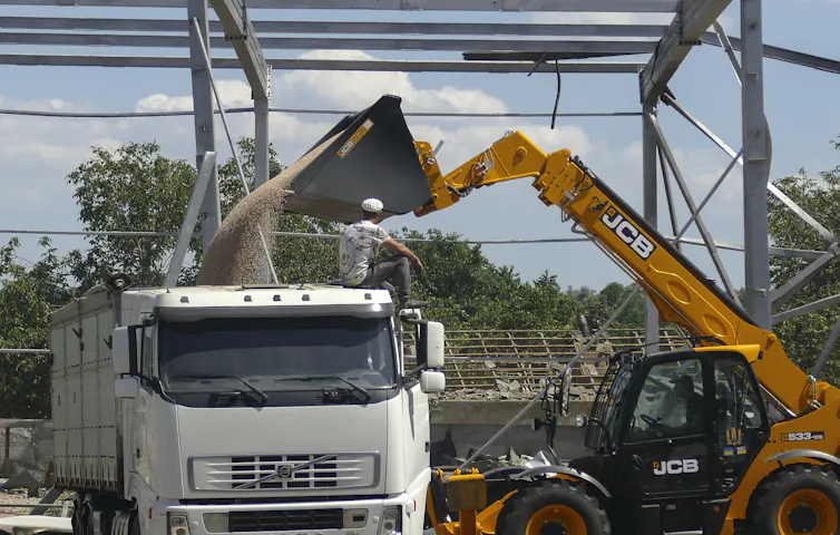 A lorry takes on a load of grain at a storage depot in Ukraine.