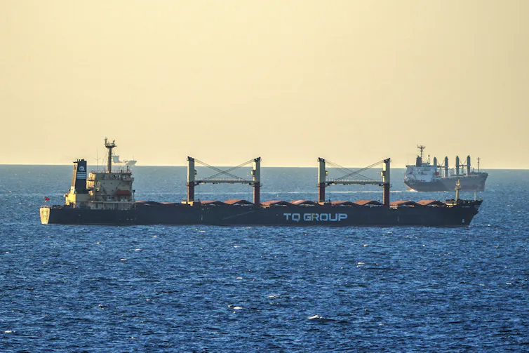 A cargo ship floating in the ocean