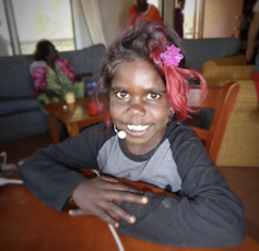 A young girl participates in the Kriol study.