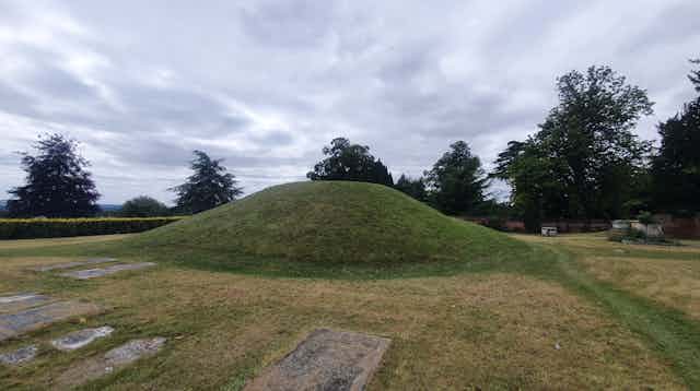 A grassy burial mound