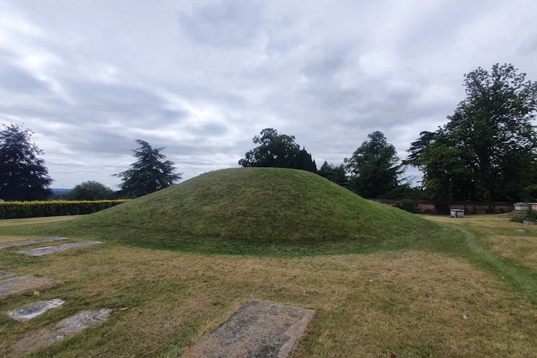 A grassy burial mound