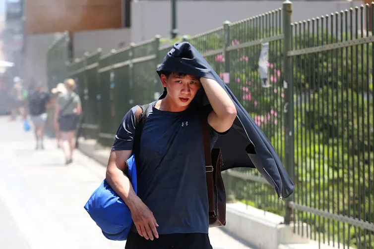 Young man struggling in the heat in Athens