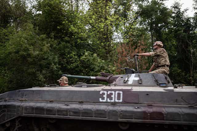 A Ukrainian tank crew moves through the forests near Bahmut, eastern Ukraine, July 22 2023