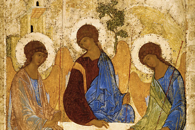 Three angels carved on wood and painted gold.