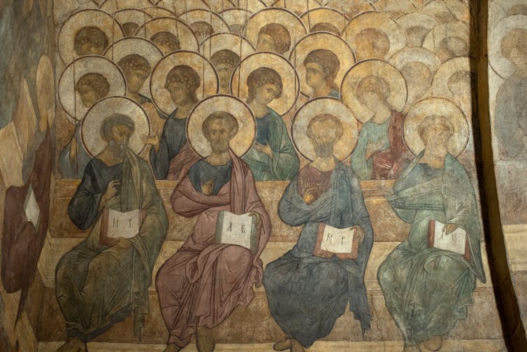 Painting of apostles sat in rows with halos