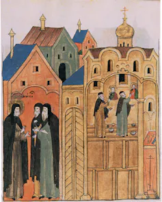Painting of men in a huddle in front of tall colourful houses.
