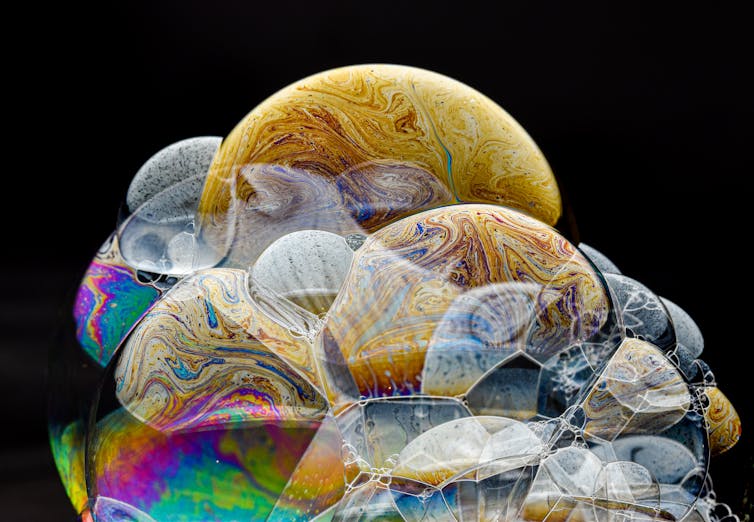 Cosmic-looking soap bubbles against a black background