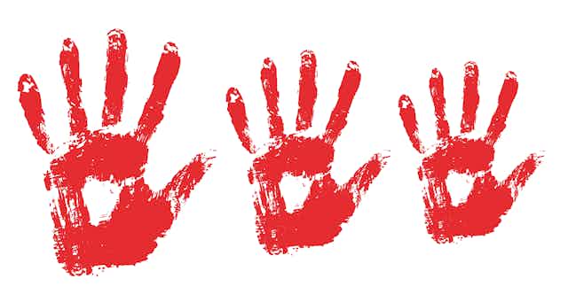 Three blood red handprints