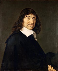 A portrait of a man with a mustache. He has shoulder-length brown hair and is wearing a black robe with a white collar.
