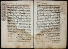 Two pages of a book with writing in Arabic.