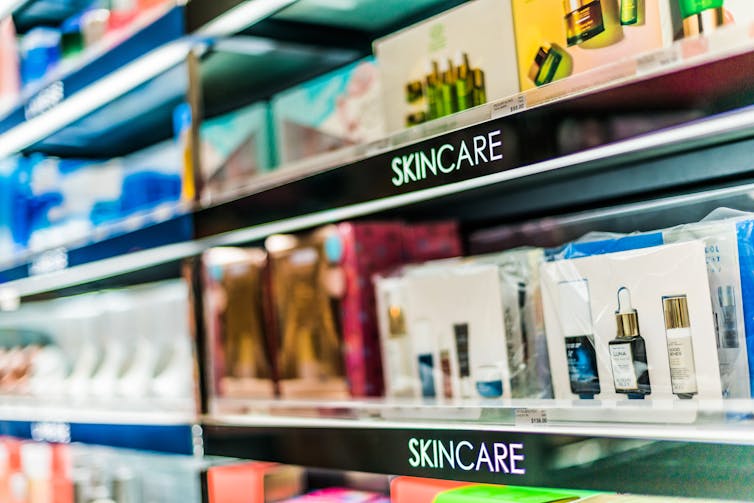 Shelves in a shop reading 'skincare' with many different products on the display.