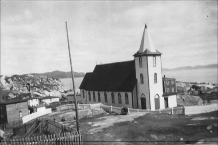 A black and white photo of a church