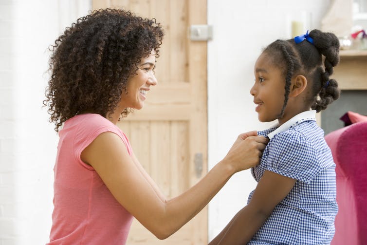 A mother talking with child.