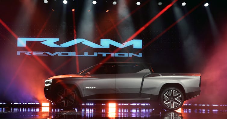 A very modern-looking concept-car truck beneath the Ram automotive brand name.