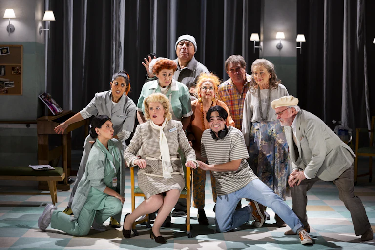 Production image: a crowd sings