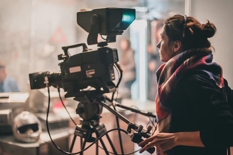 A woman behind a camera