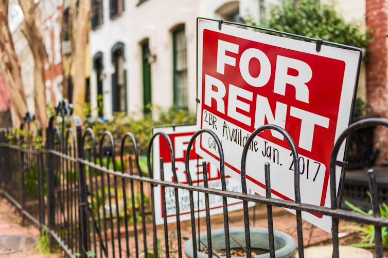 Two red and white signs saying