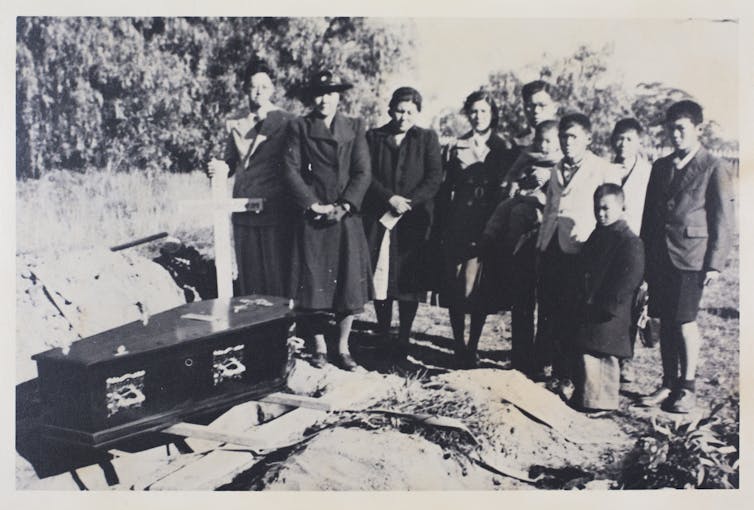 Coffin, mother, children.