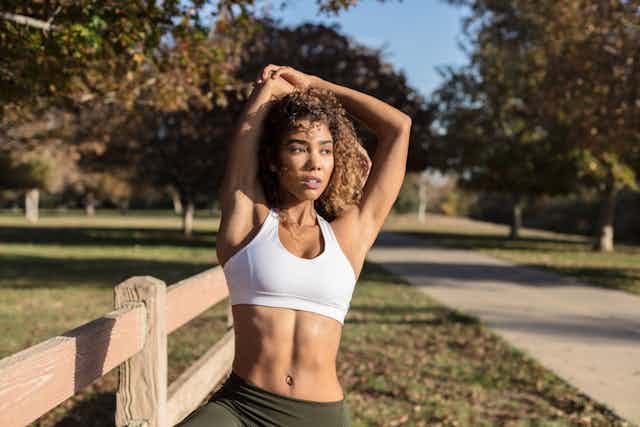 Can I wear a normal bra under my sports bra during exercise for