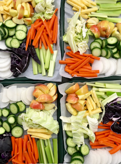 Different compartments of vegetables chopped.