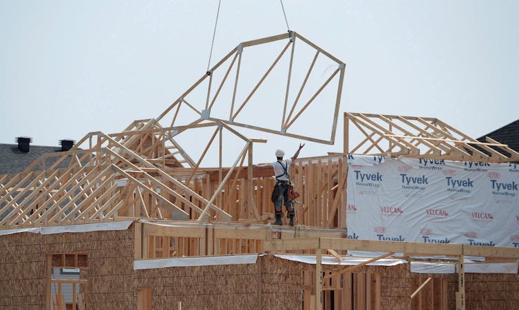 Construction workers building a home