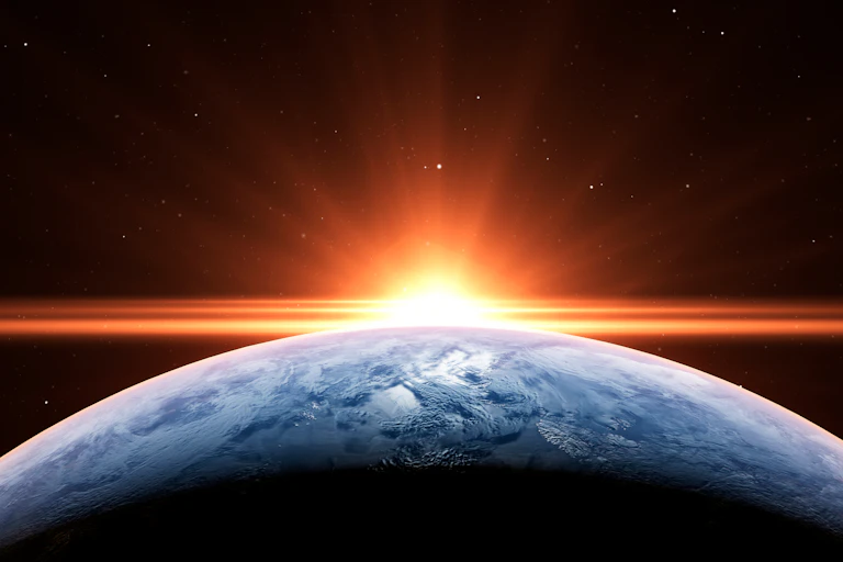 Sunrise in space over Earth.