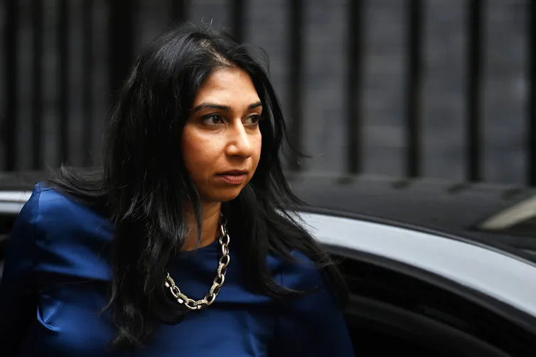 Suella Braverman getting out of a car.