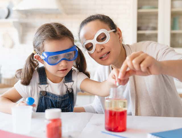 Mother and daughter doing science experiment