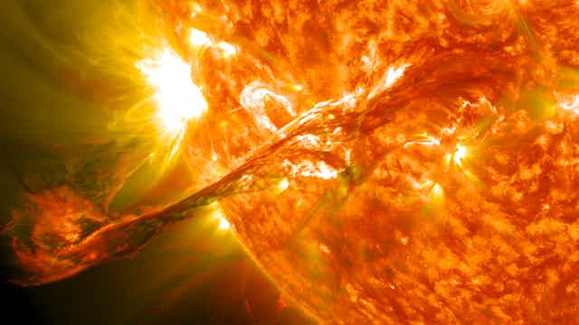 a shooting stream of particles from the sun's surface