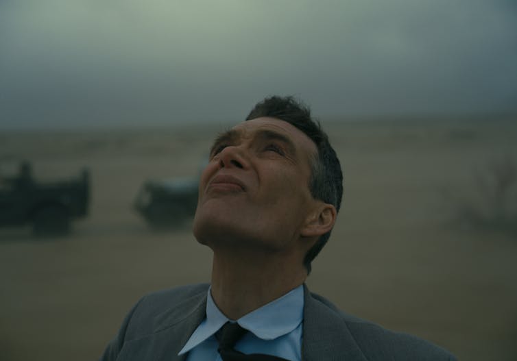 Cillian Murphy as Oppenheimer looks to the sky.