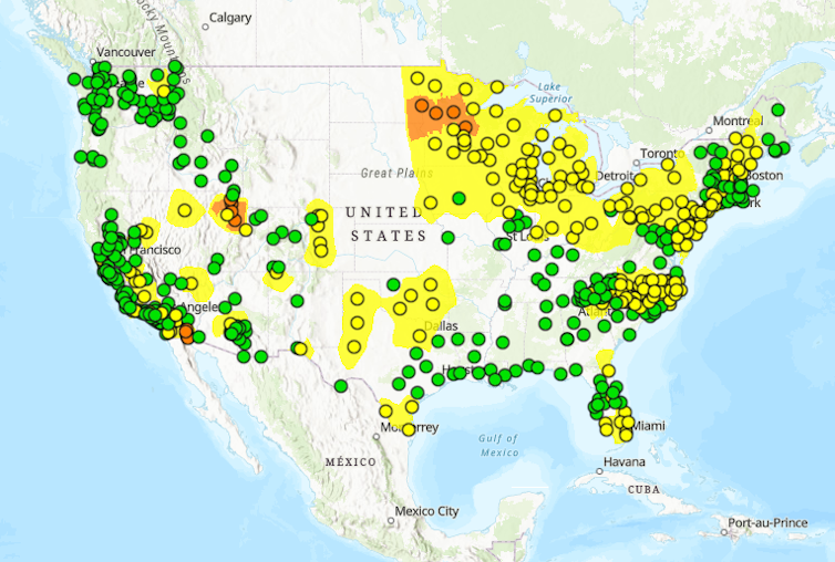 A map shows many yellow dots through the Midwest. in particular, where wildfire smoke has been blowing in from Canada.