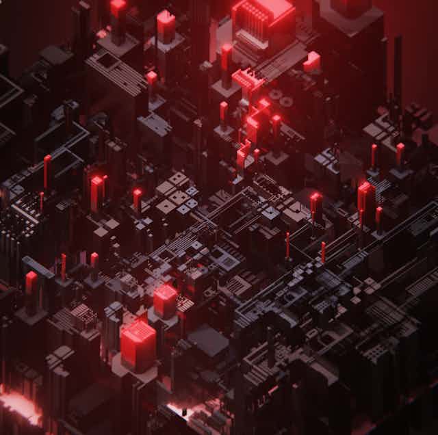 A macro photo of an electronic circuit that looks like an ominously lit cityscape