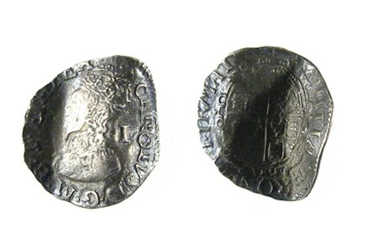 a bent silver penny