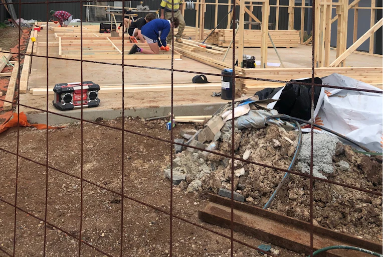 Workers on a home construction site