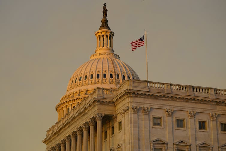 A large white building with a dome atop it.