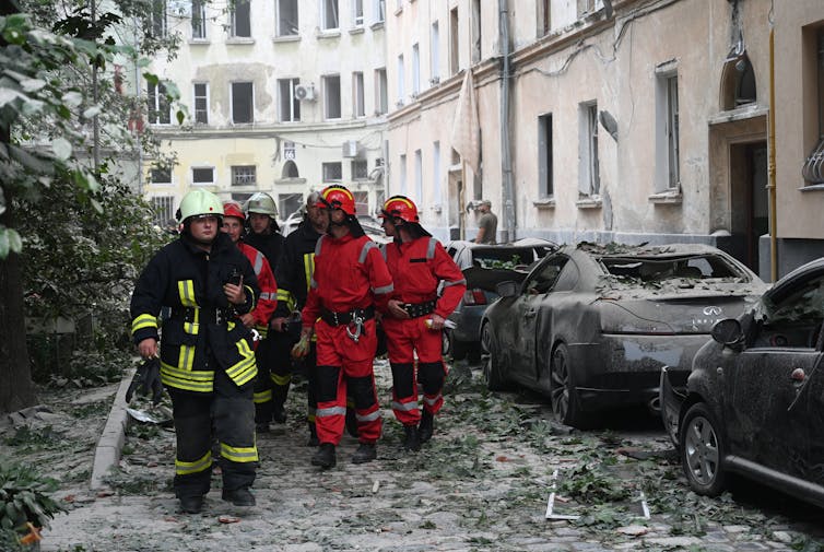 Rescuers work in the aftermath of a Russian missile strike in Lviv, July 2023.