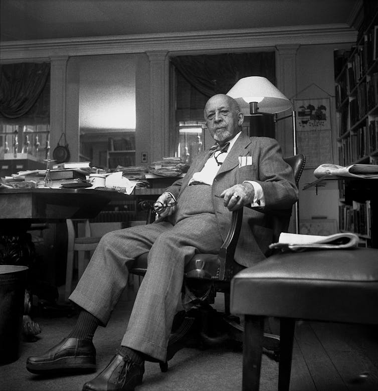 Author, sociologist, historian and civil rights activist W.E.B. Du Bois poses for a portrait in a study room.