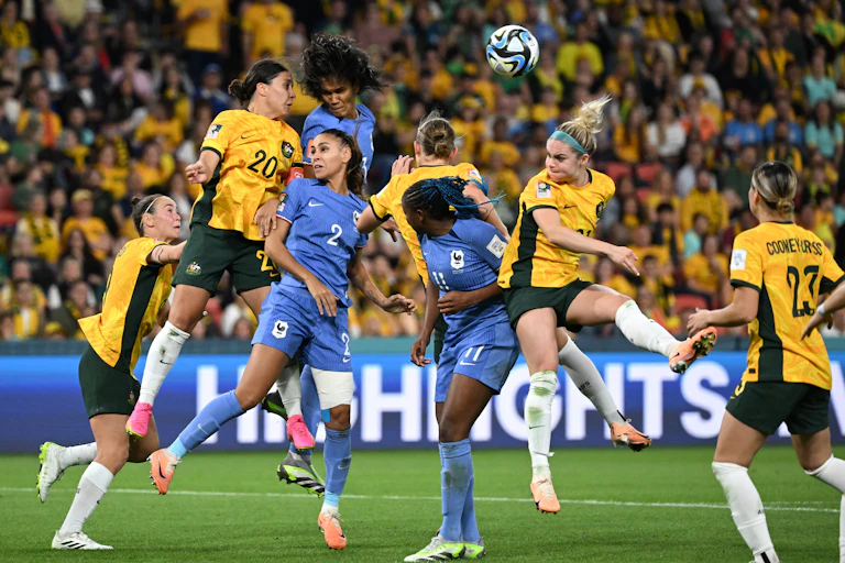 Players jumping for a header during the quarter final between Australia and France