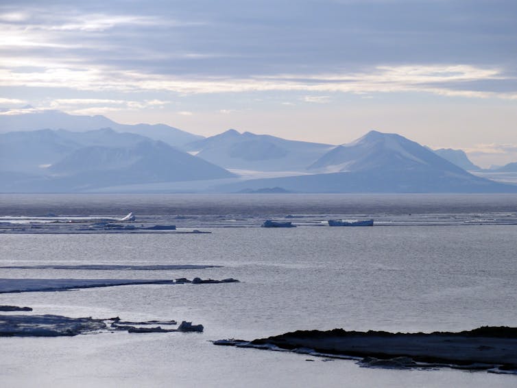 A photo of icy mountains looming over Ross Sea in east Antarctica