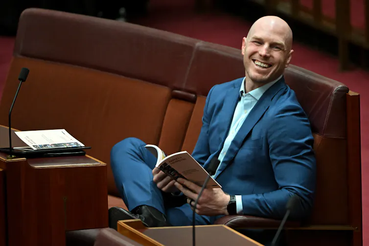 man smiling in parliament