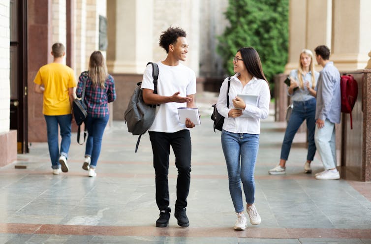 Students walking and chatting on campus