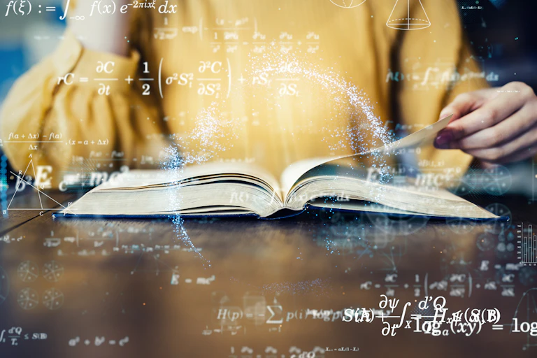Someone wearing a yellow shirt holds open a book. Various math equations and figures float around it.