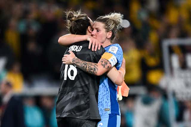 Mackenzie Arnold of Australia is consoled by Millie Bright of England