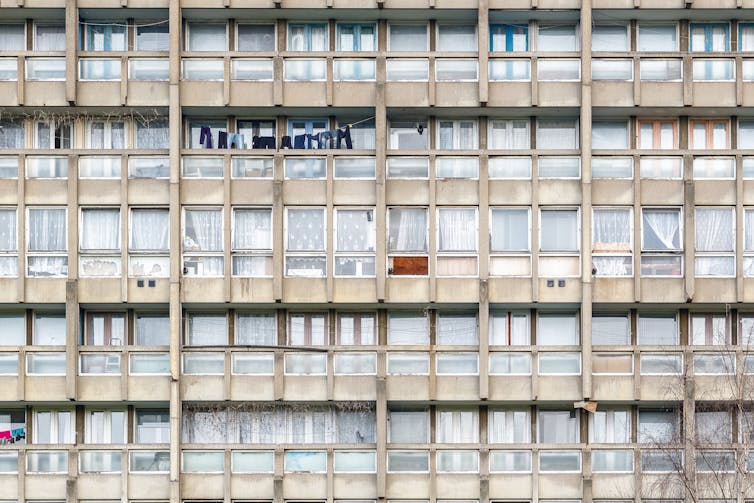 The side of a block of council flats in disrepair in London